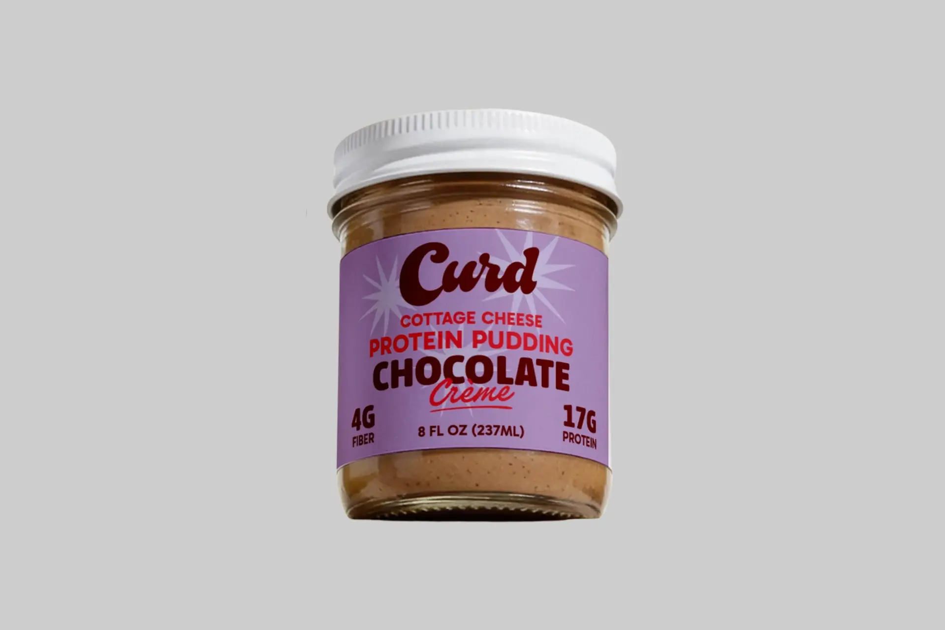 A cup of creamy Curd Chocolate Crème Protein Pudding, rich and dark, ready to be enjoyed as a healthy dessert or snack. - Product Review